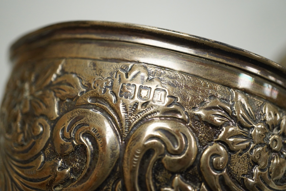 A pair of Edwardian repousse silver pedestal bowls, by Charles Boyton & Son Ltd, London, 1906, diameter 11.4cm(a.f.), 6.9oz and a plated two handled dish.